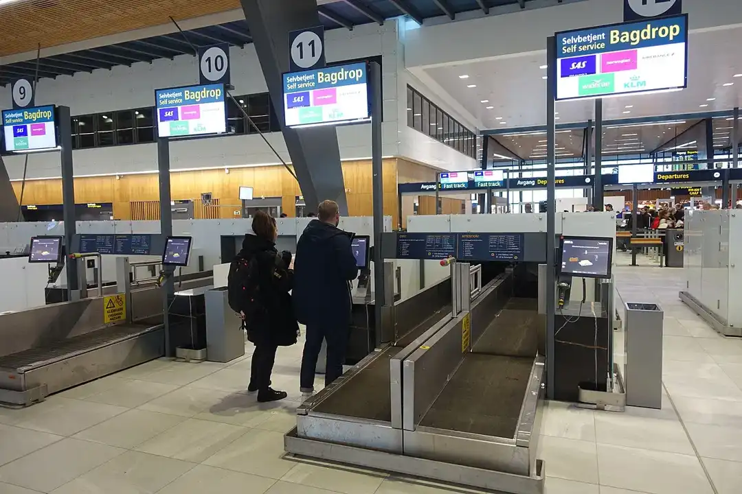 Self-service bag drop conveyor at an airport